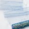 12 Pack: 6" x 8yd. Iridescent Chunky Glitter Tulle by Celebrate It™